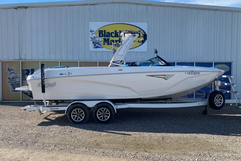 The Image of 2024 Tigé Z3 boat on trailer outside Blackbeard Marine dealership. - 1