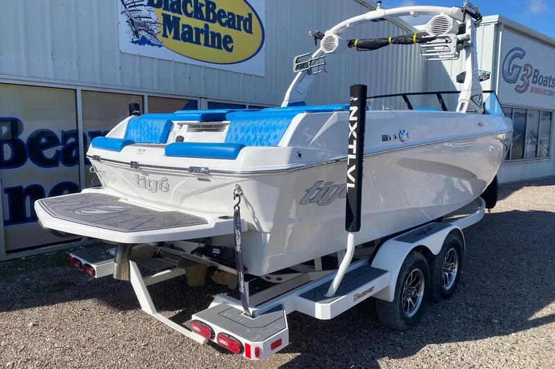 Slide: The Image of 2024 Tigé Z3 boat on trailer at BlackBeard Marine dealership. - 6