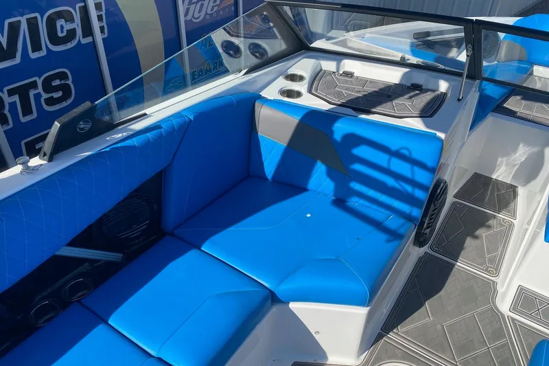 Slide: The Image of 2024 Tigé Z3 boat interior with blue seating and modern design elements. - 7