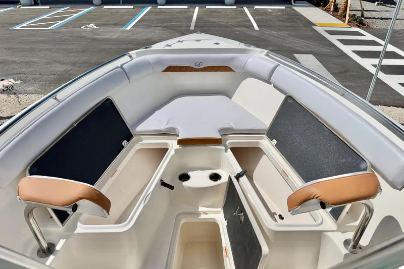 Slide: The Image of 2021 Sailfish 242 CC boat interior with seating and storage compartments. - 10