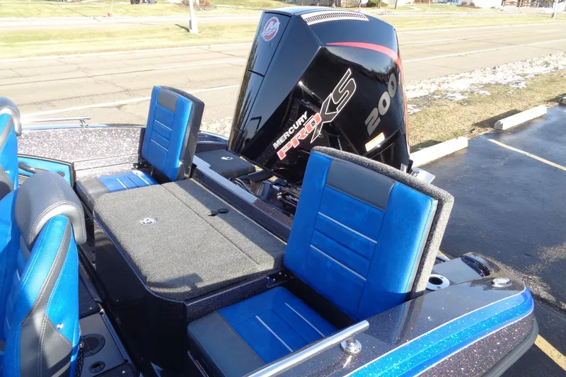 Slide: The Image of 2026 Ranger 1880MS Angler boat with blue seating and Mercury Pro XS engine. - 10