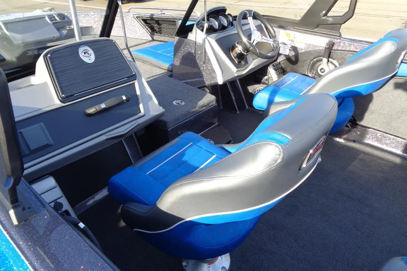Slide: The Image of 2026 Ranger 1880MS Angler boat interior with blue seats and modern dashboard. - 11