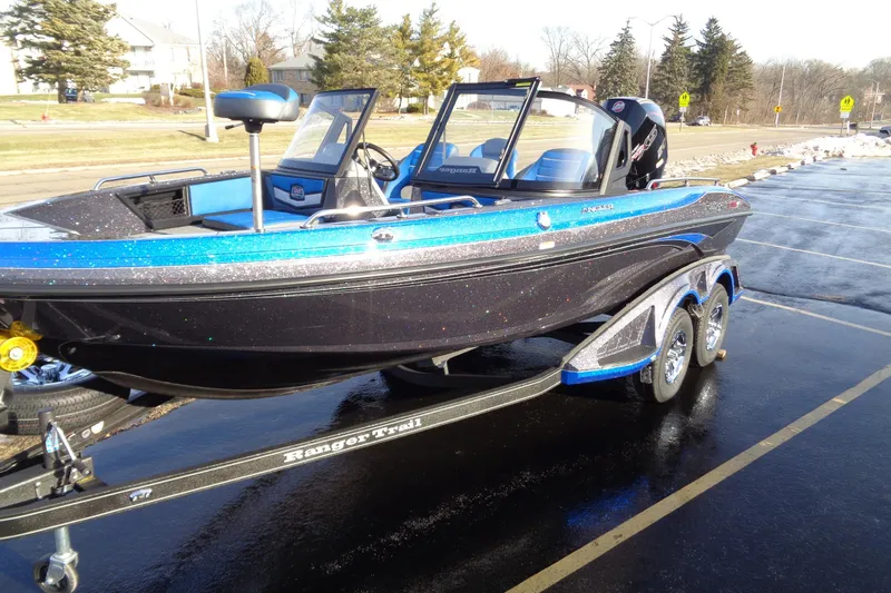 Slide: The Image of 2026 Ranger 1880MS Angler boat on trailer, parked in sunny outdoor setting. - 4