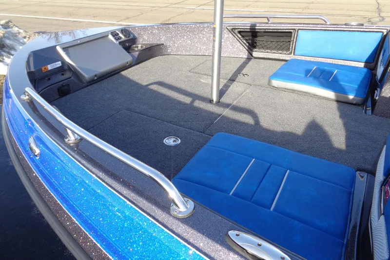 Slide: The Image of 2026 Ranger 1880MS Angler boat interior with blue seating and control panel. - 5