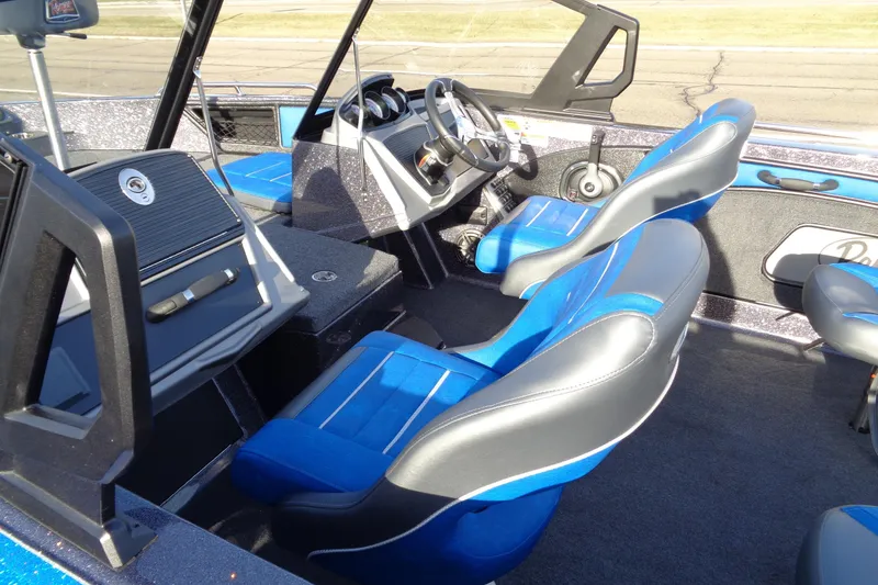 Slide: The Image of 2026 Ranger 1880MS Angler boat interior with blue and gray seating, steering console, and dashboard. - 6