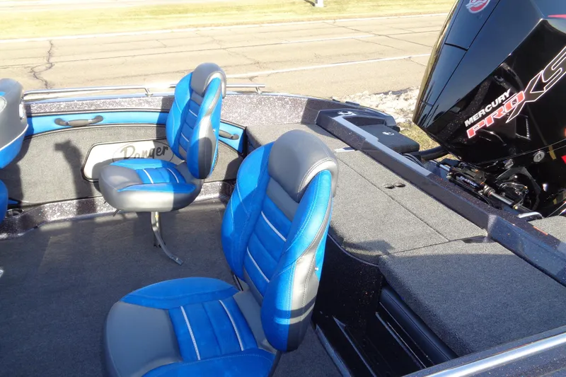 Slide: The Image of 2026 Ranger 1880MS Angler boat interior with blue seats and Mercury Pro XS engine. - 7
