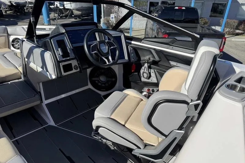 Slide: The Image of 2022 Supra SL boat interior with modern steering and seating design. - 14