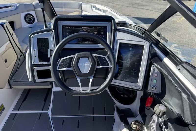 Slide: The Image of 2022 Supra SL boat dashboard with advanced controls and touchscreen displays. - 17