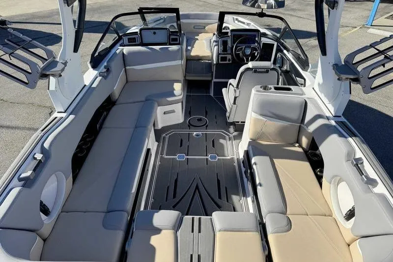 Slide: The Image of 2022 Supra SL boat interior with spacious seating and modern dashboard design. - 6