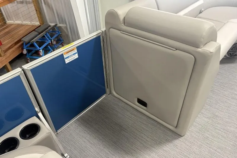 Slide: The Image of Interior of 2025 Godfrey Xperience 2286 SBX pontoon boat with beige seating and blue panel. - 15