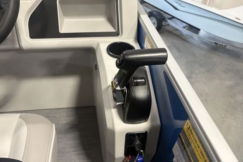 Slide: The Image of Interior of 2025 Godfrey Xperience 2286 SBX boat with Yamaha throttle control. - 22