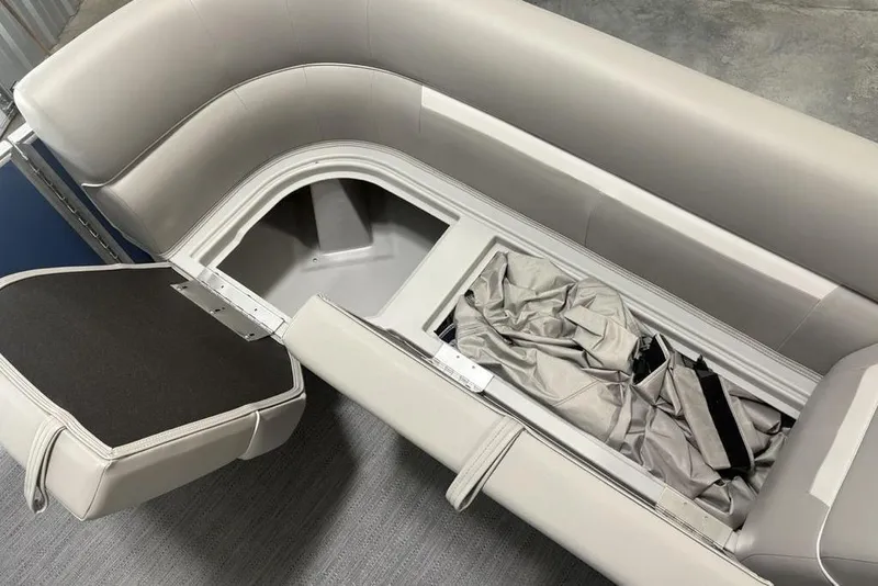 Slide: The Image of Open storage compartment in 2025 Godfrey Xperience 2286 SBX boat with seating. - 3