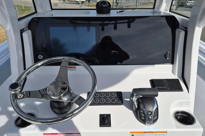 Slide: The Image of 2026 Sportsman Heritage 231 Center Console dashboard with steering wheel and controls. - 15