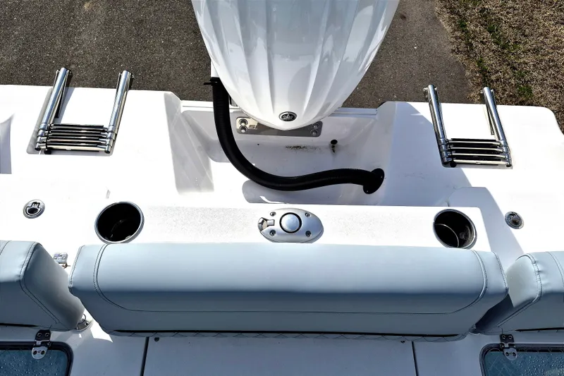 Slide: The Image of 2026 Sportsman Heritage 231 Center Console boat deck with seating and cup holders. - 17