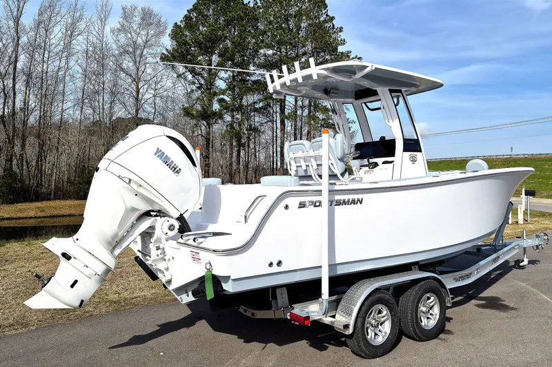 Slide: The Image of 2026 Sportsman Heritage 231 Center Console boat on trailer, featuring Yamaha outboard motor. - 2