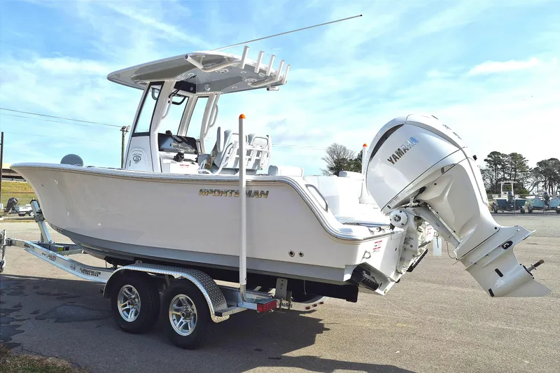 Slide: The Image of 2026 Sportsman Heritage 231 Center Console boat on trailer, featuring Yamaha outboard motor. - 4