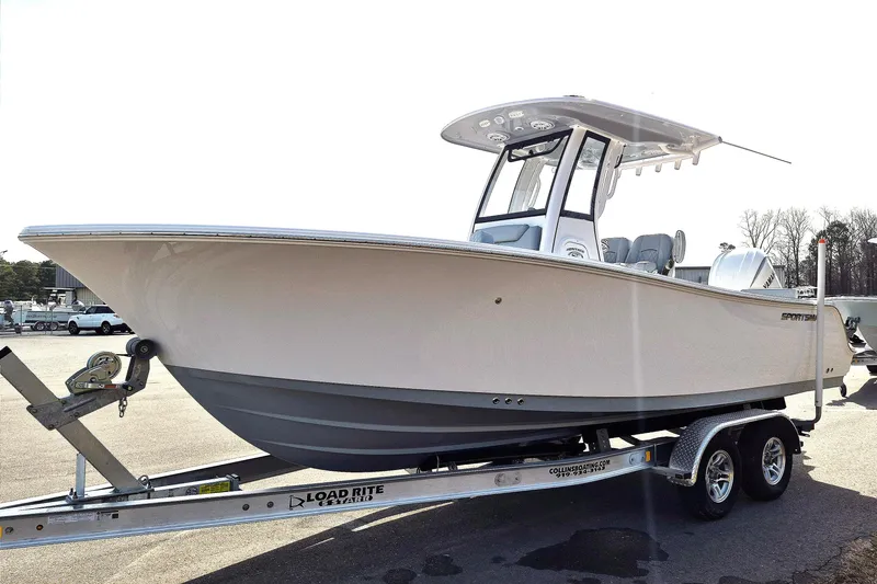 Slide: The Image of 2026 Sportsman Heritage 231 Center Console boat on trailer, side view. - 6