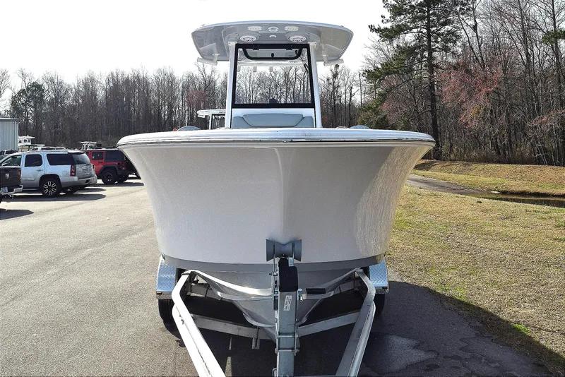 Slide: The Image of 2026 Sportsman Heritage 231 Center Console boat on trailer, parked outdoors. - 7