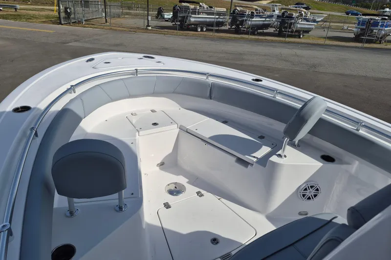 Slide: The Image of 2026 Sportsman Heritage 231 Center Console boat interior with seating and storage compartments. - 8