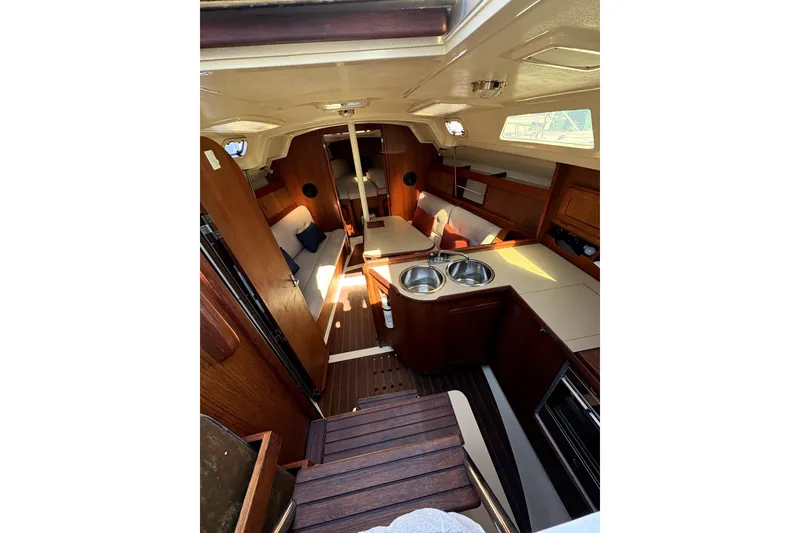 Slide: The Image of Interior of 1989 Hunter 30 sailboat with compact kitchen and wooden cabinetry. - 12