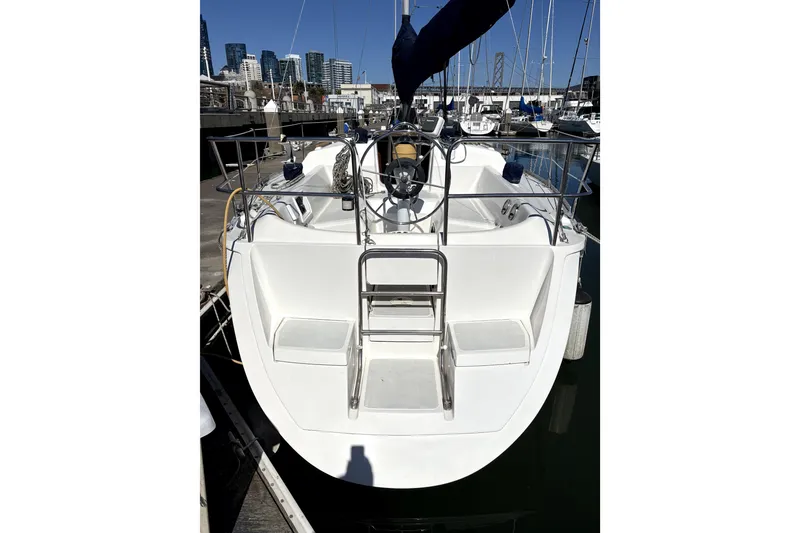 Slide: The Image of 1989 Hunter 30 sailboat named "Banshee" docked at a marina. - 3
