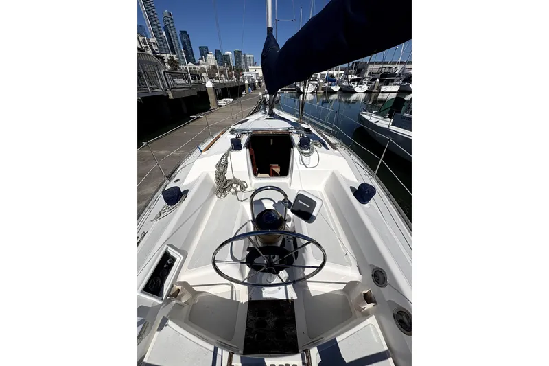 Slide: The Image of 1989 Hunter 30 sailboat docked at marina, sunny day, clear sky. - 6