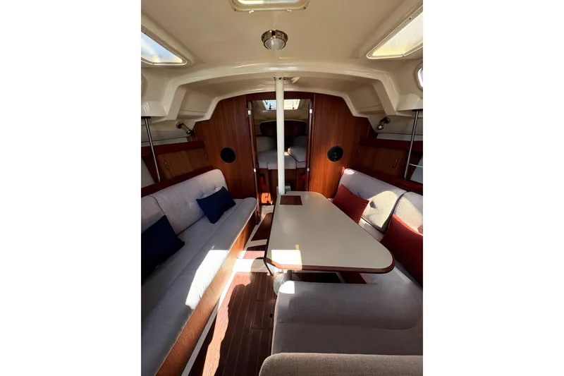 Slide: The Image of Interior of 1989 Hunter 30 sailboat, featuring cozy cabin with wood accents and compact layout. - 9