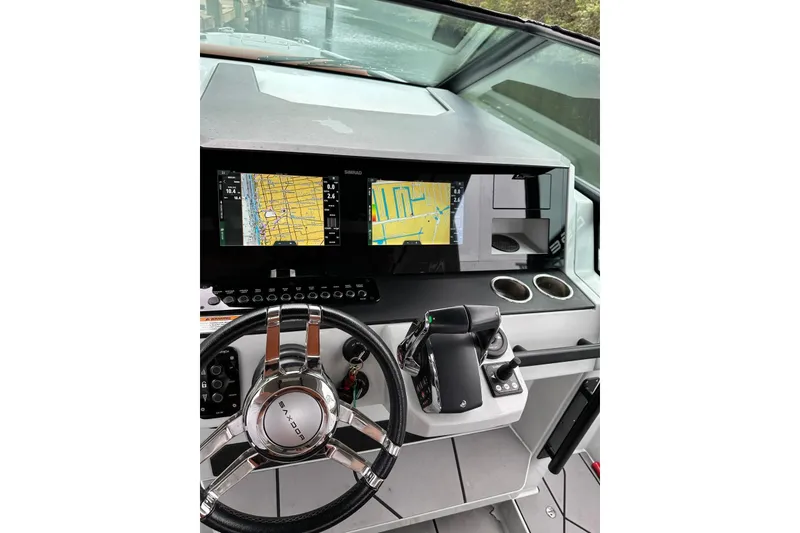 Slide: The Image of Helm of 2023 Saxdor 320 GTO with navigation screens and steering wheel. - 7