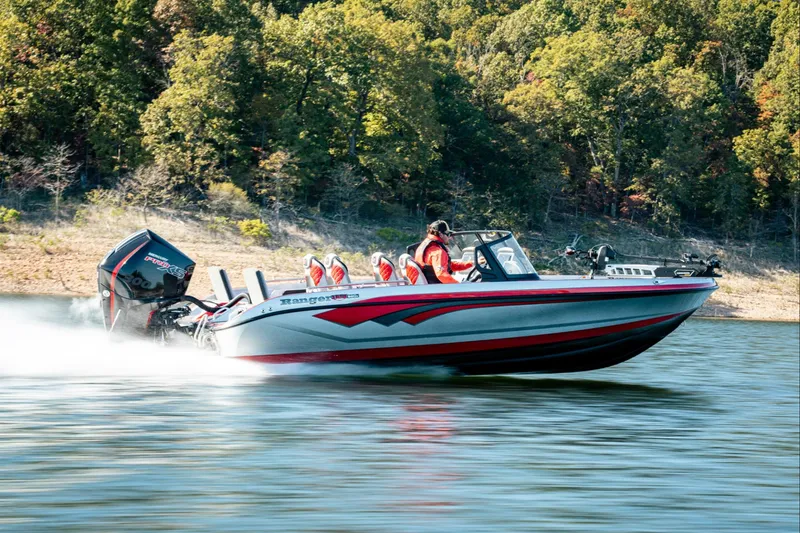 Slide: The Image of Manufacturer Provided Image: 2026 Ranger 620xFS Pro boat speeding on a lake with forested shoreline. - 102