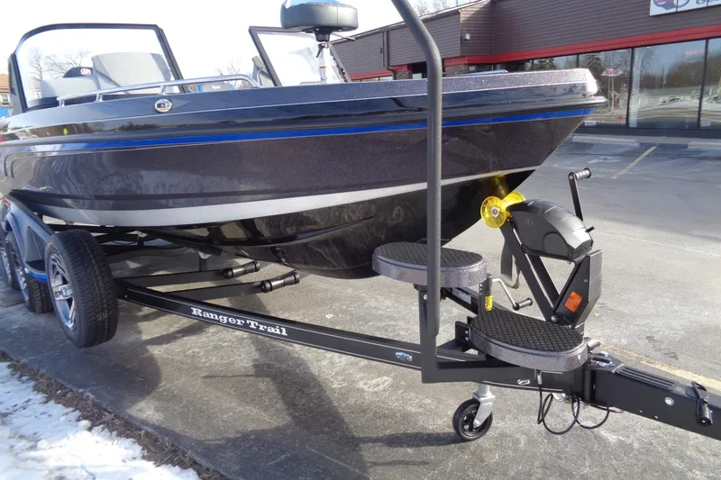 Slide: The Image of 2026 Ranger 620xFS Pro boat on trailer in parking lot. - 12