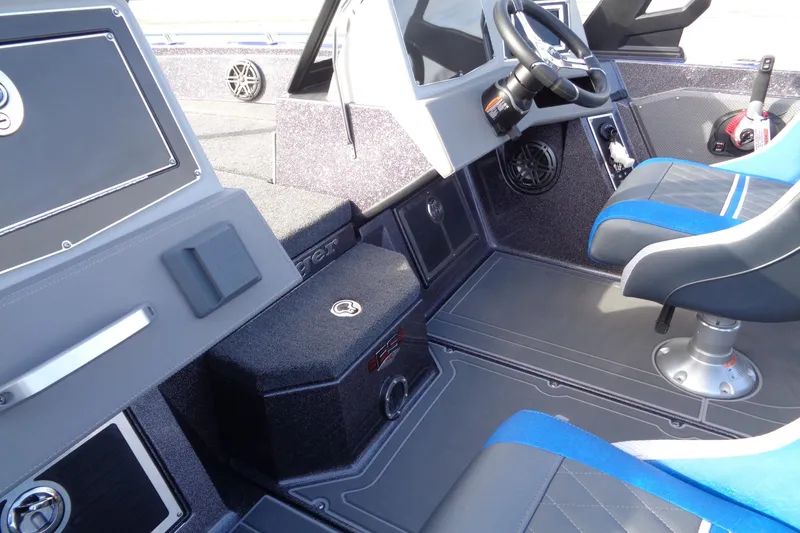 Slide: The Image of 2026 Ranger 620xFS Pro boat interior with steering wheel and seating. - 18