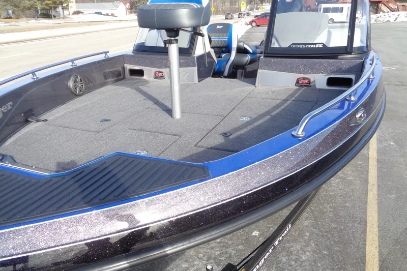 Slide: The Image of 2026 Ranger 620xFS Pro boat with blue accents and spacious deck. - 20