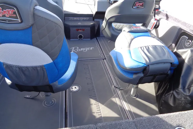 Slide: The Image of 2026 Ranger 620xFS Pro boat interior with blue and gray seating, featuring Ranger branding. - 21