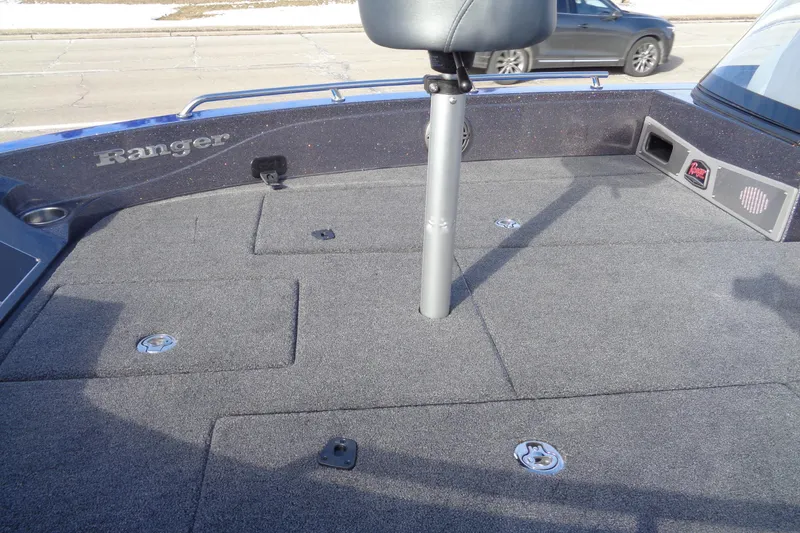 Slide: The Image of 2026 Ranger 620xFS Pro boat deck with seating and storage compartments. - 23