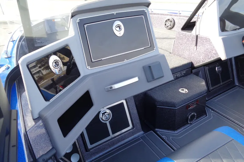 Slide: The Image of 2026 Ranger 620xFS Pro boat interior with sleek dashboard and storage compartments. - 4