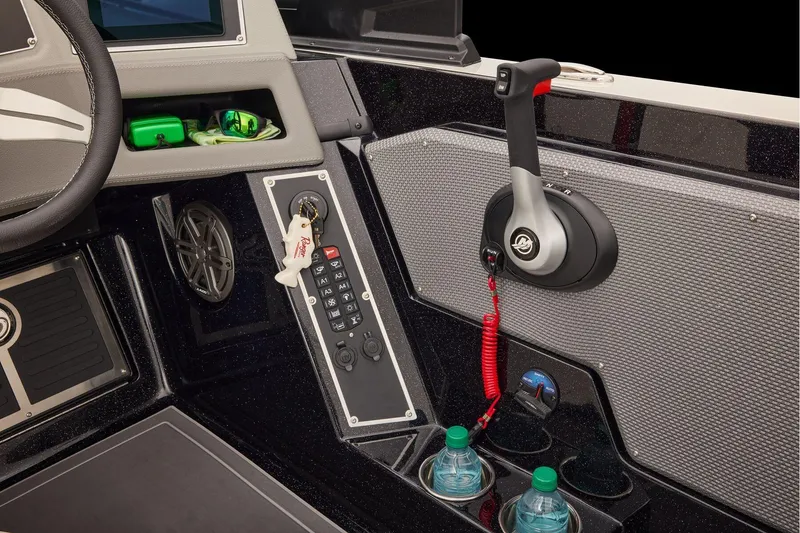 Slide: The Image of Manufacturer Provided Image: 2026 Ranger 620xFS Pro boat dashboard with controls, steering wheel, and storage compartments. - 69