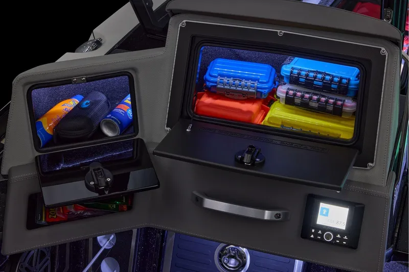 Slide: The Image of Manufacturer Provided Image: 2026 Ranger 620xFS Pro storage compartments with colorful gear boxes and sunscreen. - 75