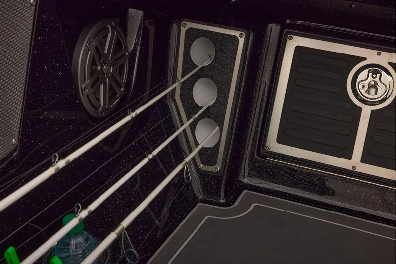 Slide: The Image of Manufacturer Provided Image: Interior of 2026 Ranger 620xFS Pro boat with fishing rod holders and speaker. - 79