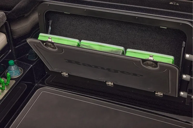 Slide: The Image of Manufacturer Provided Image: 2026 Ranger 620xFS Pro boat storage compartment with green tackle boxes. - 82