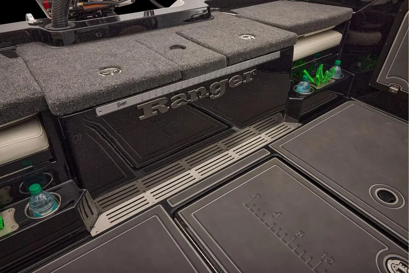 Slide: The Image of Manufacturer Provided Image: 2026 Ranger 620xFS Pro boat interior with storage, cup holders, and measuring ruler. - 88