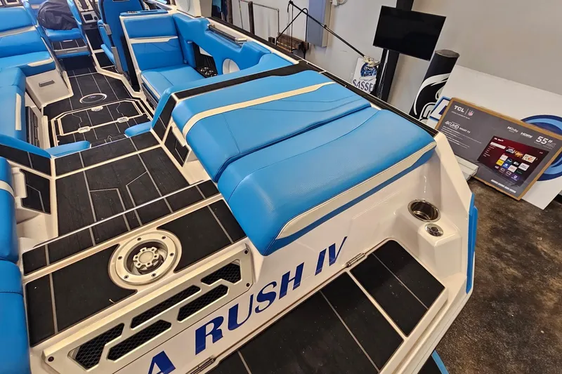 Slide: The Image of 2023 Supra SE 550 boat interior with blue seating and modern design. - 11
