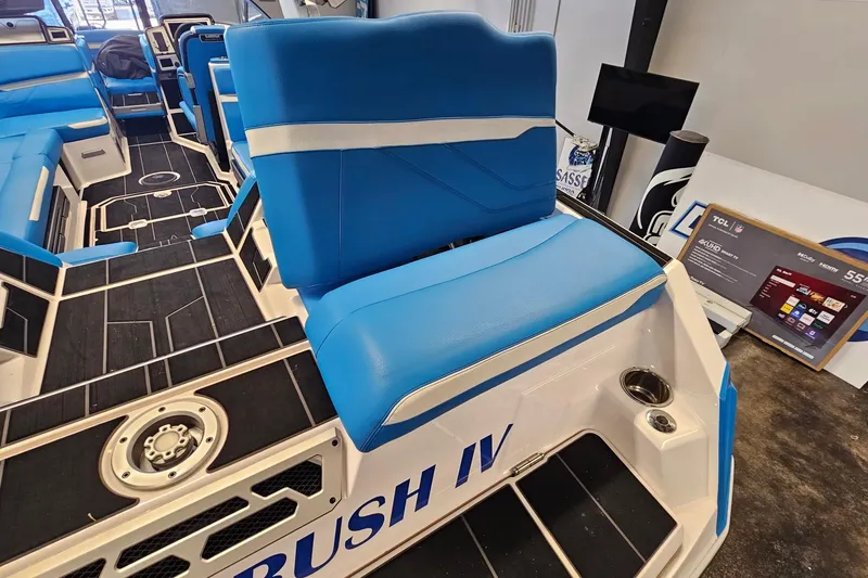 Slide: The Image of 2023 Supra SE 550 boat interior with blue seating and modern design. - 12