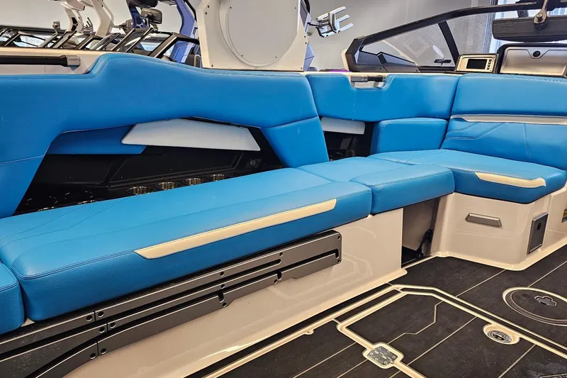 Slide: The Image of 2023 Supra SE 550 boat interior with blue seating and modern design. - 18