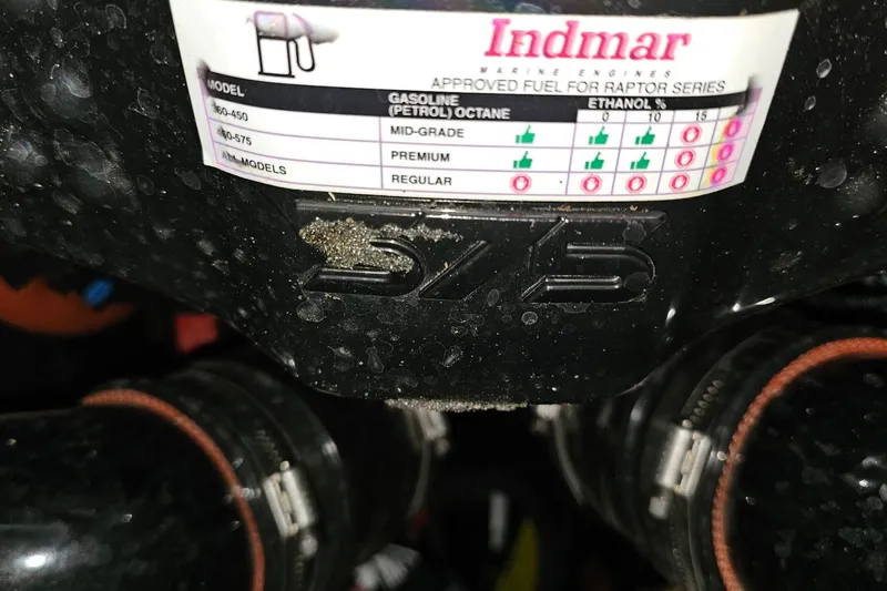 Slide: The Image of 2023 Supra SE 550 engine with Indmar fuel specifications label. - 24