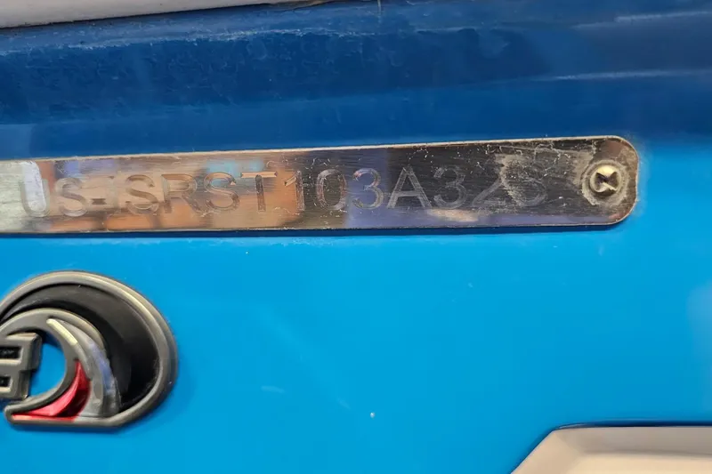 Slide: The Image of 2023 Supra SE 550 boat identification plate on blue surface. - 25