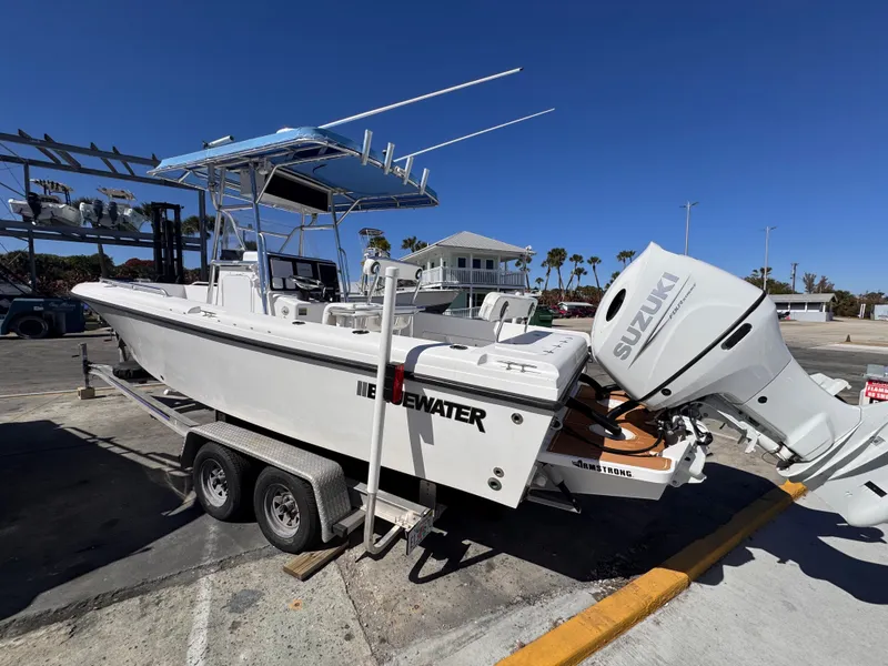 The Image of 2003 Bluewater 24 boat with Suzuki engine on trailer. - 0