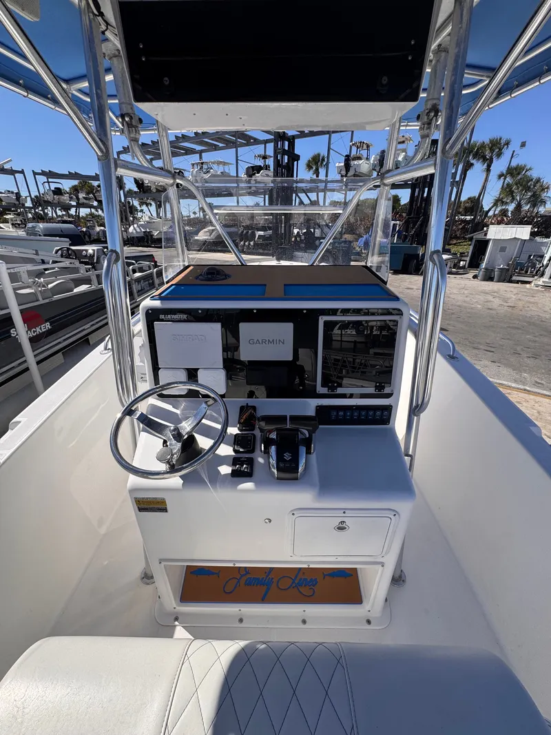 Slide: The Image of Helm console of a 2003 Bluewater 24 boat with Garmin equipment. - 2