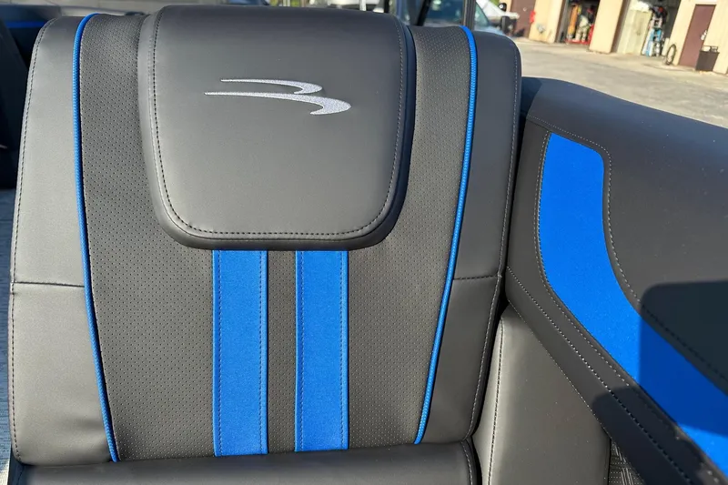 Slide: The Image of Close-up of 2026 Bennington 22 SSR Quad Bench seat with blue accents. - 13