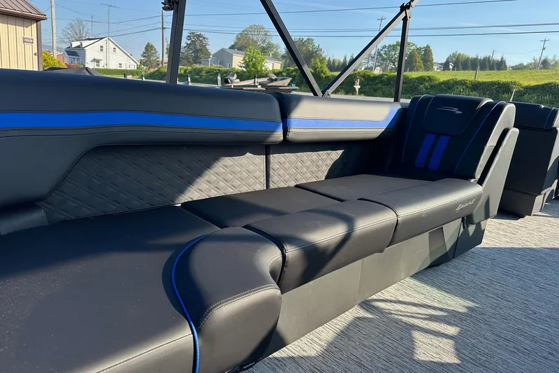 Slide: The Image of Luxurious seating on 2026 Bennington 22 SSR Quad Bench, featuring sleek black and blue design. - 23