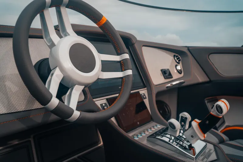 Slide: The Image of 2024 MTI 390X interior with sleek steering wheel and advanced controls. - 10